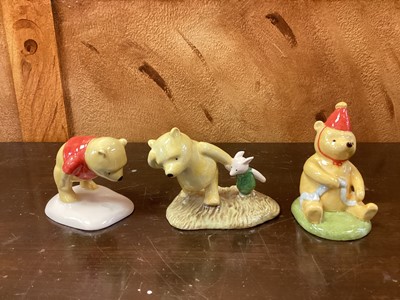 Lot 1189 - Eleven Royal Doulton Winnie The Pooh figures - Christopher Robin, Winnie The Pooh and the Paw-Marks, Christopher Reads to Pooh, Rabbit Reads the Plan, Christopher Robin and Pooh, Pooh and Piglet th...