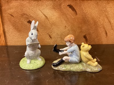 Lot 1189 - Eleven Royal Doulton Winnie The Pooh figures - Christopher Robin, Winnie The Pooh and the Paw-Marks, Christopher Reads to Pooh, Rabbit Reads the Plan, Christopher Robin and Pooh, Pooh and Piglet th...