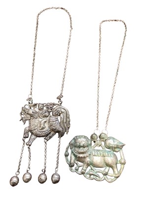 Lot 5 - Two old Chinese white metal necklaces, one with a pierced and embossed plaque depicting a figure on a dragon/horse, with bells suspended on chains from the hooves, the other depicting a temple drag...
