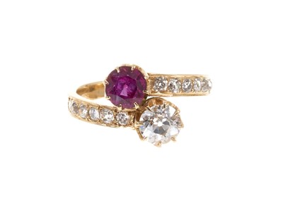 Lot 413 - Early 20th century ruby and diamond two stone cross-over ring