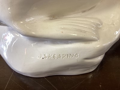Lot 1203 - A John Skeaping for Wedgwood cream glazed model of a Seal, circa 1920s, the seal raised on front flippers and set on a stylised 'glacier' base, impressed 'John Skeaping' mark to back of base, impre...