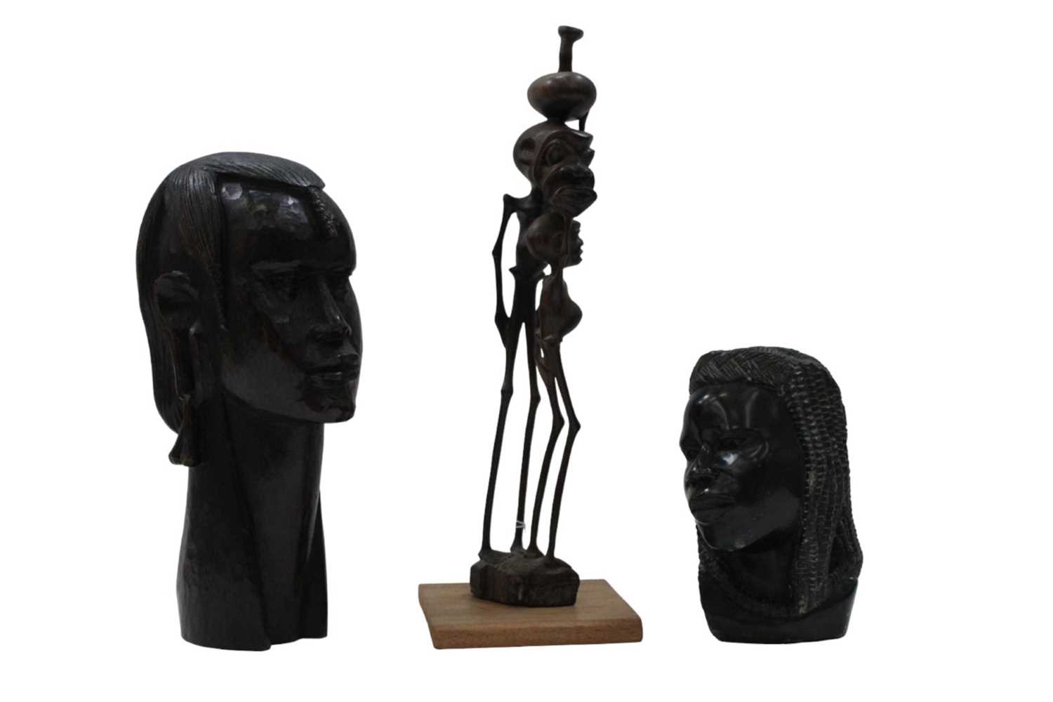 Lot 2480 - Three carved African heads