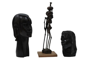 Lot 683 - Three carved African heads