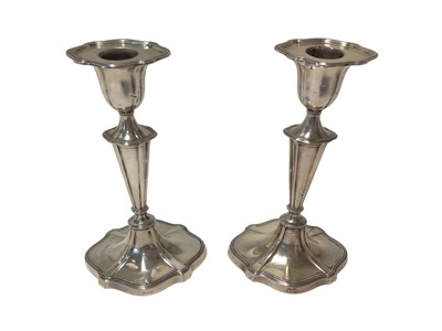 Lot 293 - Pair late Victorian silver candlesticks with tapering stems and bell shaped candle holders