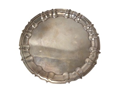 Lot 296 - Late Victorian silver waiter of circular form, with piecrust border, on three leaf scroll feet