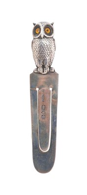 Lot 287 - Victorian silver novelty book mark, the terminal formed as an owl, with glass eyes, seated on a perch, (London 1898) Sampson Morden & Co. 9cm overall length.