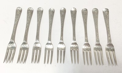 Lot 289 - Set of nine George III silver fruit forks, with engraved foliate decoration