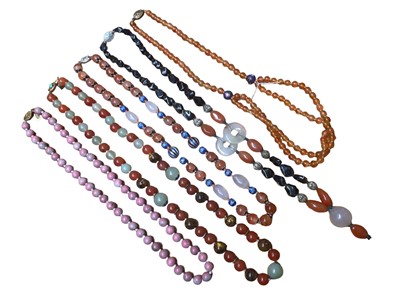 Lot 15 - Five Chinese bead necklaces including green hard stone, pink hard stone, carnelian, hematite, enamelled beads etc, all with silver clasps