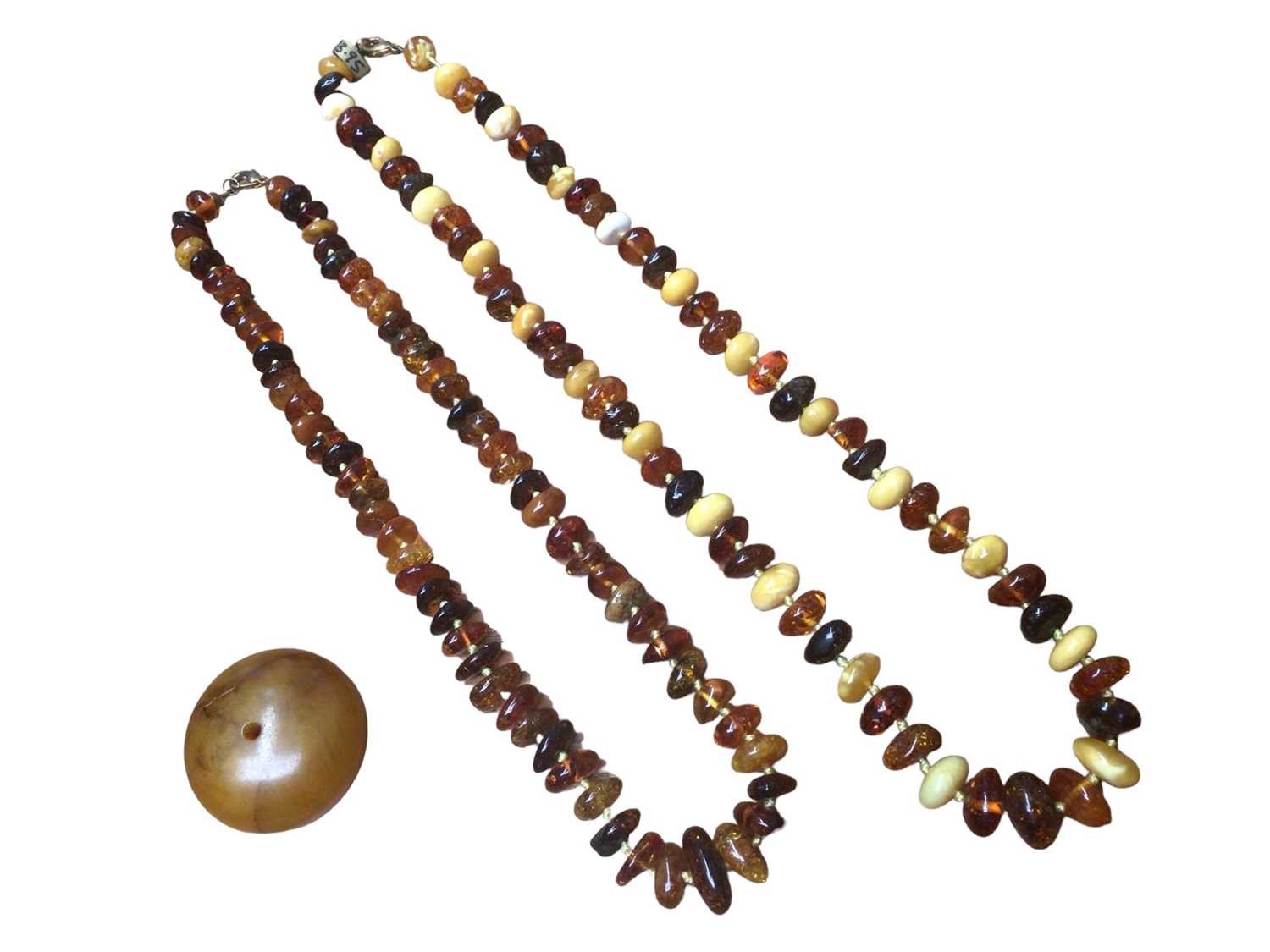Lot 20 - Two amber bead necklaces and a large reconstituted bead