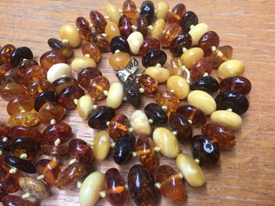 Lot 20 - Two amber bead necklaces and a large reconstituted bead