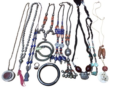 Lot 21 - Group of Chinese and Eastern jewellery including three necklaces with coral and white metal beads, lapis lazuli necklace with carved fish pendant, turquoise necklace, white metal locket pendant set...