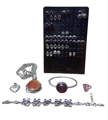 Lot 23 - Group of silver gem set stud earrings, silver bangle set with an amethyst cabochon, similar bracelet, silver mounted carnelian pendant on chain, silver pink stone ring and a silver heart locket