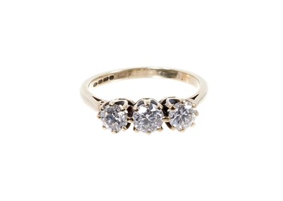 Lot 466 - Diamond three stone ring with three round brilliant cut diamonds in claw setting on 9ct gold shank