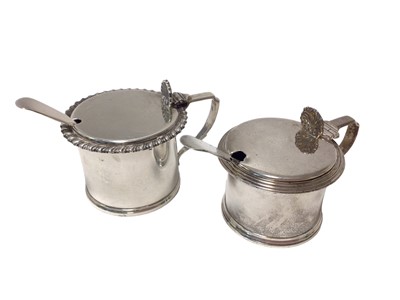 Lot 244 - Two silver mustard pots and a pair of silver plated condiment spoons