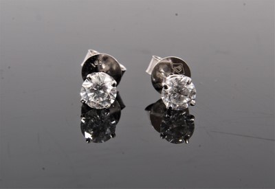 Lot 407 - Pair of diamond single stone stud earrings, each with a round brilliant cut diamond in four claw 14ct white gold setting