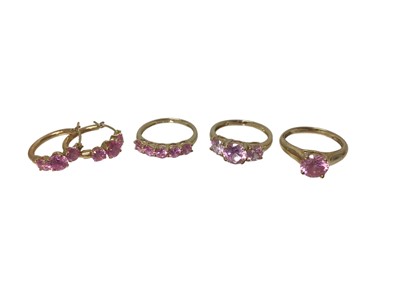 Lot 88 - Three 14ct gold pink synthetic stone rings and a pair of similar 14ct gold hoop earrings