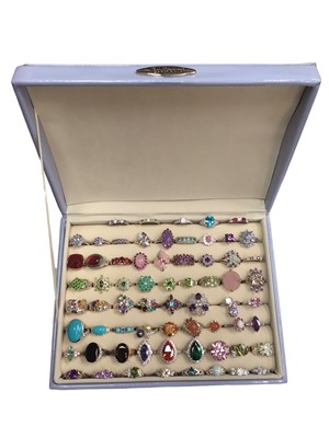 Lot 101 - Collection of silver multi-gem set dress rings within a ring display case (66)