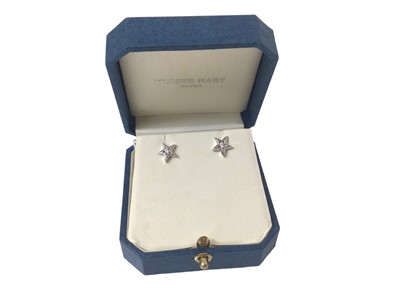 Lot 107 - Pair of 18ct white gold diamond set star stud earrings, boxed