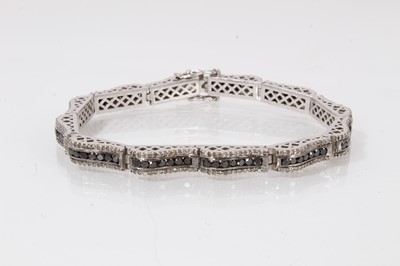 Lot 505 - Black and white diamond bracelet in white gold setting