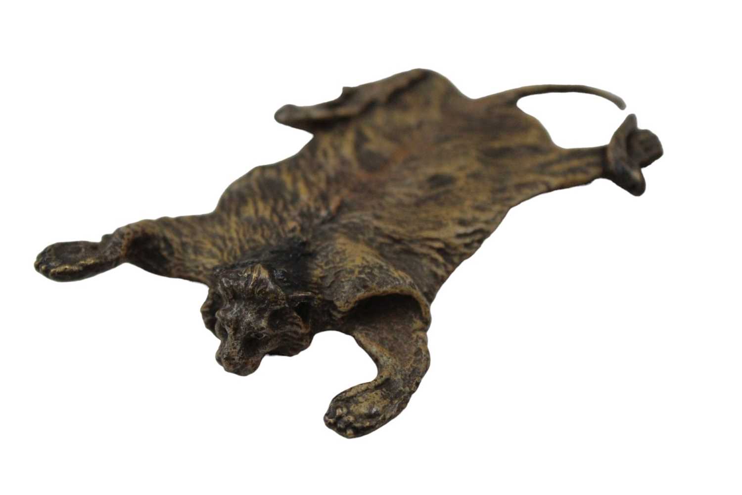 Lot 2463 - A cold painted bronze lion skin rug, stamped 'Austria' and with a 'B' in an urn, possibly Franz Bergman, 10cm long