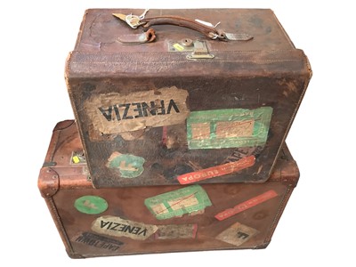 Lot 2097 - Two pieces of of vintage 1920s/30s luggage to include a large brown leather suitcase with inner fittings, locks and keys and a hat box with lock and key