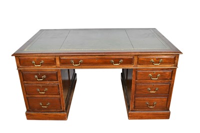 Lot 1085 - Georgian style mahogany twin pedestal desk with tooled green leather top, eight drawers with brass handles on plinth base, 153cm wide x 91cm deep x 76cm high