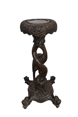 Lot 1082 - Late 19th century Burmese carved hardwood plant table with circular top on carved legs with dragon’s head feet