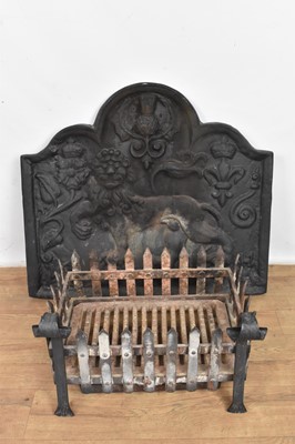 Lot 1083 - Cast iron fire back and a wrought iron fire basket