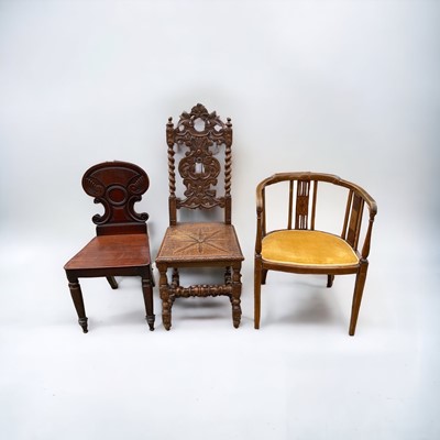 Lot 1222 - Regency mahogany hall chair, Victorian carved oak hall chair and an Edwardian inlaid mahogany tub chair (3)