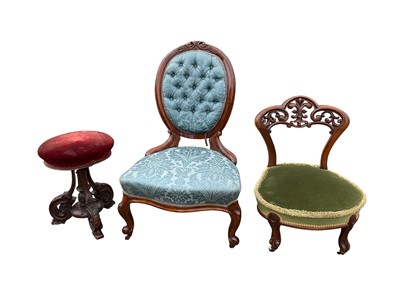 Lot 1214 - Victorian spoon back chair carved walnut frame upholstered in blue damask, a Victorian carved walnut framed nursing chair and a Victorian carved mahogany revolving piano stool with red velvet seat (3)