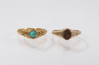 Lot 435 - Two mid 19th century gold rings to include a turquoise cabochon ring in a chased gold setting, size N and the other with a foil back stone, size J½