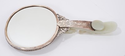 Lot 721 - Chinese jade and white metal hand mirror, stamped HK, the oval mirrored plate with convex jade plaque to the rear, carved in low relief with fruit, flowers and a bat, 25cm long, probably comprising...