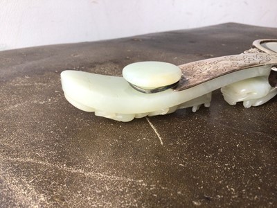 Lot 721 - Chinese jade and white metal hand mirror, stamped HK, the oval mirrored plate with convex jade plaque to the rear, carved in low relief with fruit, flowers and a bat, 25cm long, probably comprising...