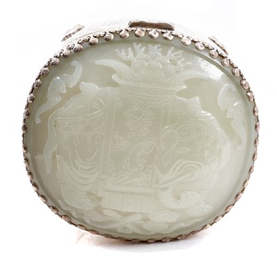 Lot 722 - Chinese jade and white metal box, the jade carved in low relief with flowers, fruit and bats, 12cm long, the jade possibly earlier than the box, in case