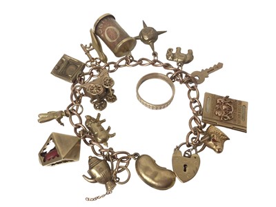 Lot 158 - 9ct gold charm bracelet with various 9ct gold and yellow metal novelty charms