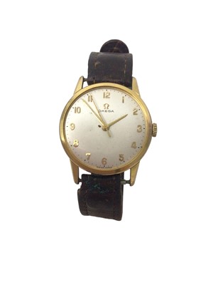 Lot 148 - Omega wristwatch with a circular dial and Arabic numeral markers in gold plated stainless steel case