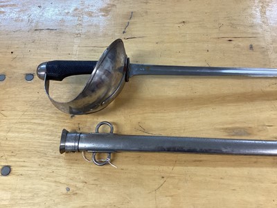 Lot 894 - Scarce British 1908 Pattern ( Mark 1) Cavalry troopers sword by Wilkinson, Pall Mall, with chequered plastic grip, bowl guard, straight blade retaining original polish in steel scabbard with two lo...