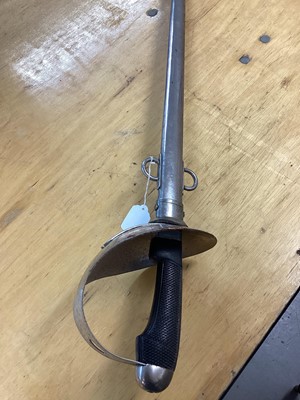 Lot 894 - Scarce British 1908 Pattern ( Mark 1) Cavalry troopers sword by Wilkinson, Pall Mall, with chequered plastic grip, bowl guard, straight blade retaining original polish in steel scabbard with two lo...