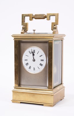 Lot 629 - Late 19th century French quarter repeating brass carriage clock in leather travelling case.