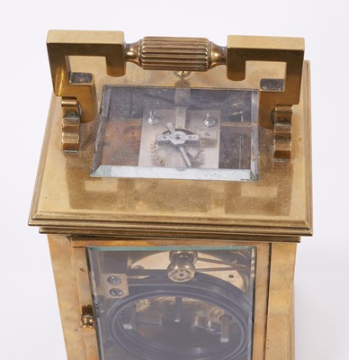 Lot 629 - Late 19th century French quarter repeating brass carriage clock in leather travelling case.