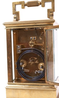 Lot 629 - Late 19th century French quarter repeating brass carriage clock in leather travelling case.