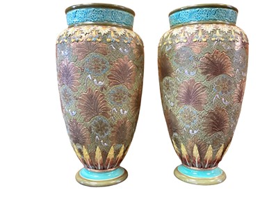 Lot 679 - Pair of Royal Doulton stoneware slaters patent vases, together with two another smaller pairs of vases and two single vases (8 vases)