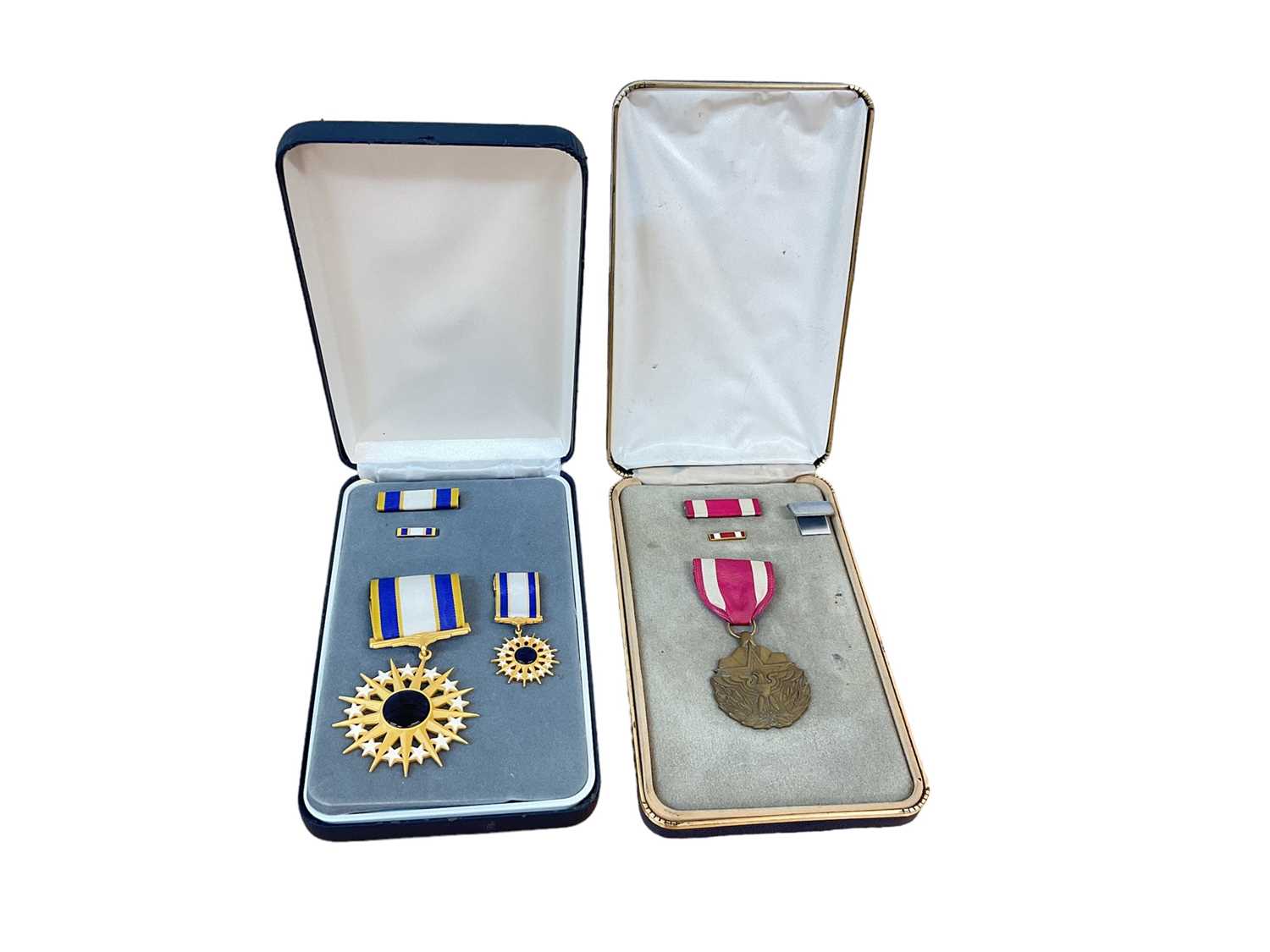 Lot 763 - American Meritorious Service medal in box, together with a USAF Distinguished Service medal in box (2)