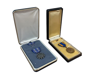 Lot 765 - American Air medal in box, together with a USAF Meritorious Achievements Award medal in box (2)