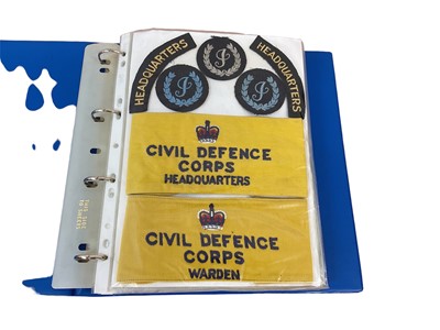 Lot 766 - One album of ARP, Civil Defence, Royal Observer Corps and other cloth badges