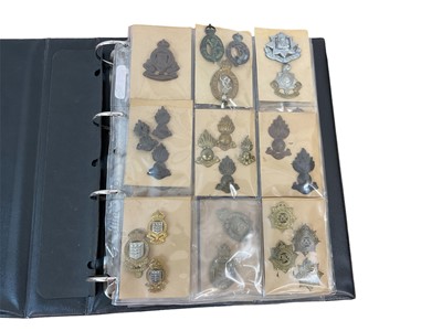 Lot 767 - One album of British military cap badges and others to include Army Ordinance Corps Wartime economy issue, First World War On War Service badges and others (approximately 101)