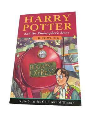 Lot 1657 - J. K. Rowling - Harry Potter and the Philosopher's Stone, early paperback edition, published 1997 with number line running 60-53, in good condition, together with four further Harry Potter paperbac...