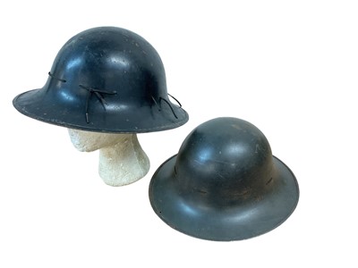 Lot 781 - Two Second World War British Zuckerman Civil Defence helmets, both with liners and chin straps (2)