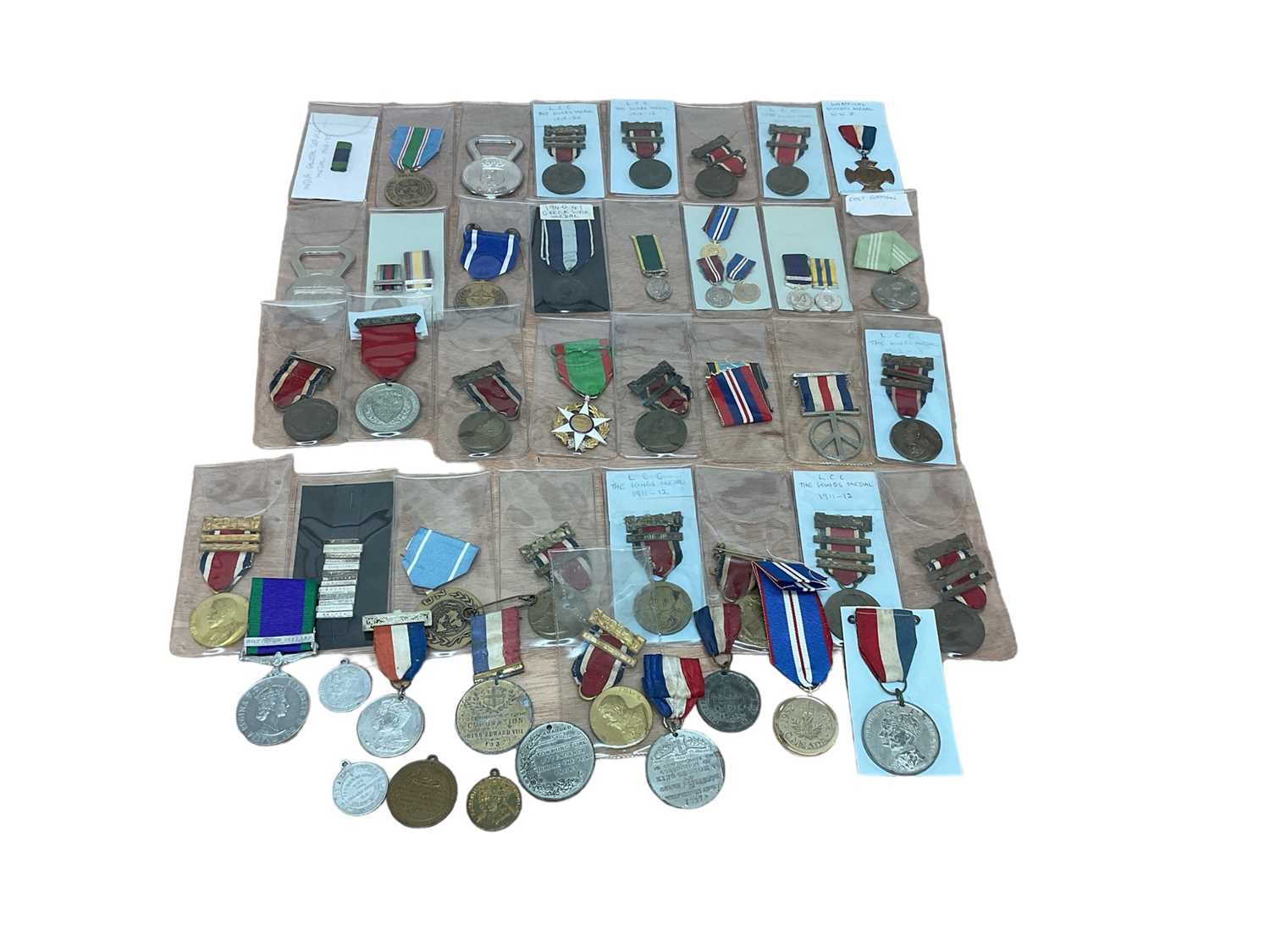 Lot 792 - Collection of miniature medals, a group of unofficial coronation and jubilee medals and other replica and copy medals (1 box)