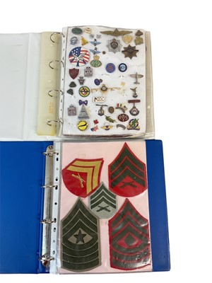 Lot 793 - One album containing a collection of sweetheart brooches, pin badges and others, together with an album of cloth badges (2 albums)